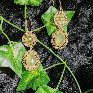 Dangled gold and green earrings